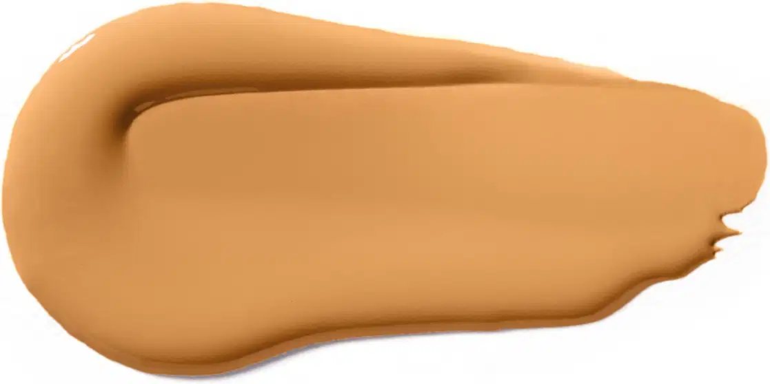 A textura do produto de beleza apresenta uma consistência cremosa e uniforme, com uma tonalidade amarelada predominante. Sua aparência é suave e sedosa, indicando uma textura aveludada e agradável ao toque.