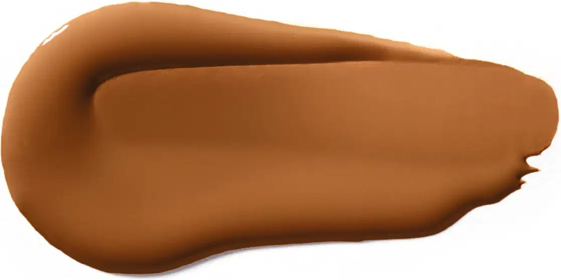 Textura cremosa e sedosa, com tonalidade marrom-dourada, sugerindo um produto de beleza da marca Vult com acabamento aveludado e aspecto suave ao toque.