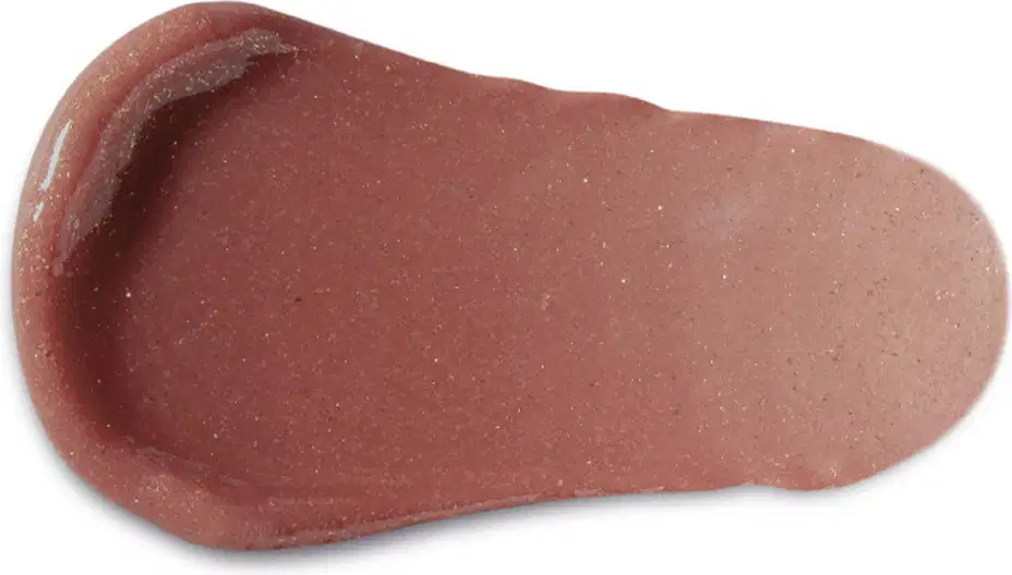 Textura cremosa e aveludada, com tonalidade marrom avermelhada e leve brilho, sugerindo um produto de beleza com acabamento suave e delicado.