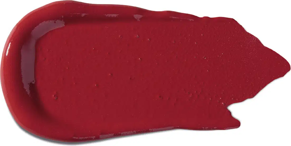 Textura cremosa e brilhante, com cor vermelha intensa e uniforme. Apresenta superfície lisa e homogênea, típica de um produto de maquiagem da marca Vult.