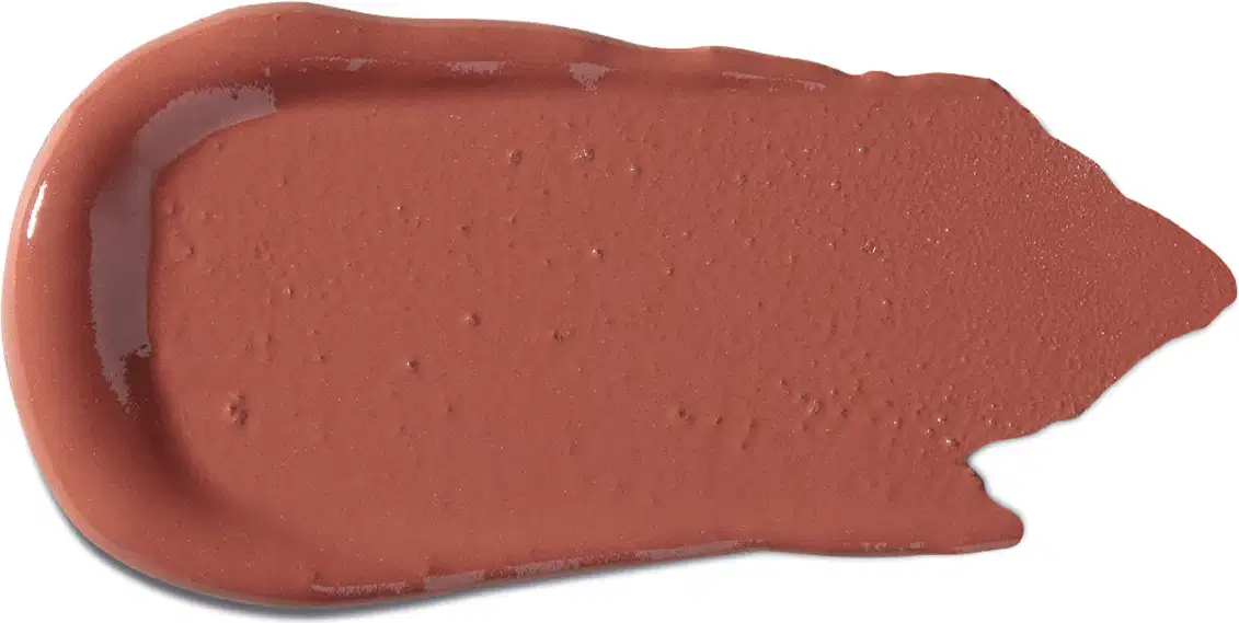 Textura cremosa e uniforme, com tonalidade marrom avermelhada característica de um produto de beleza da marca Vult. Apresenta superfície lisa e brilhante, sugerindo uma consistência macia e deslizante.