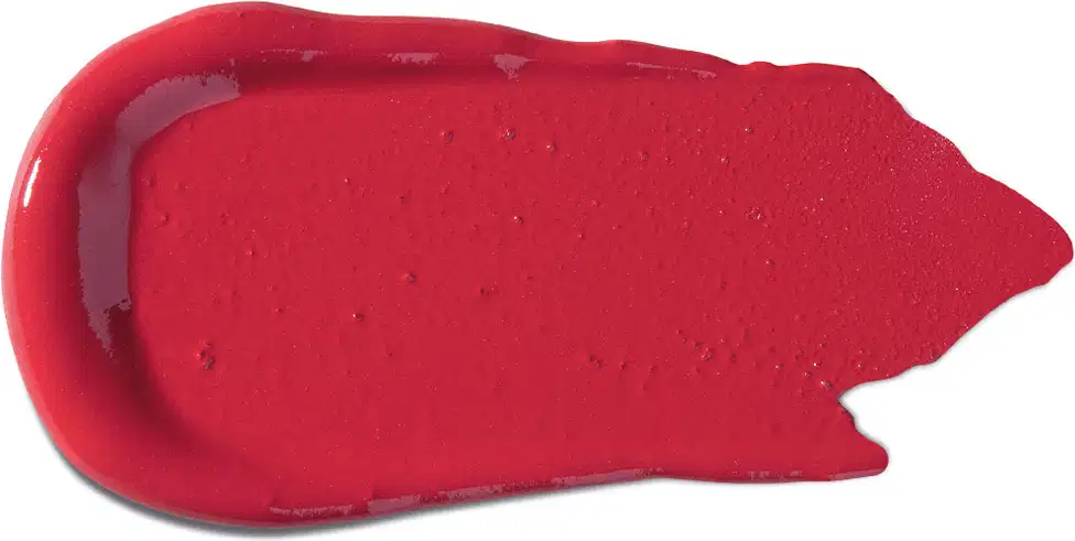 Textura cremosa e brilhante, com aparência aveludada e uniforme em tom vermelho intenso, típica de um produto de beleza da marca Vult.