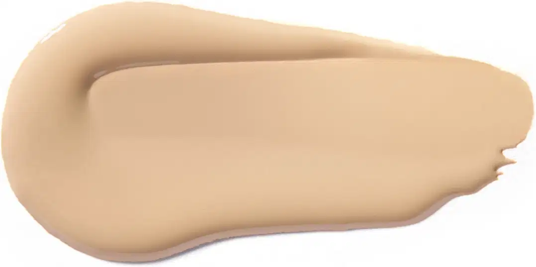 Textura cremosa e uniforme, com tonalidade bege clara, sugerindo um produto de base ou corretivo da marca Vult, com acabamento natural e aspecto aveludado.