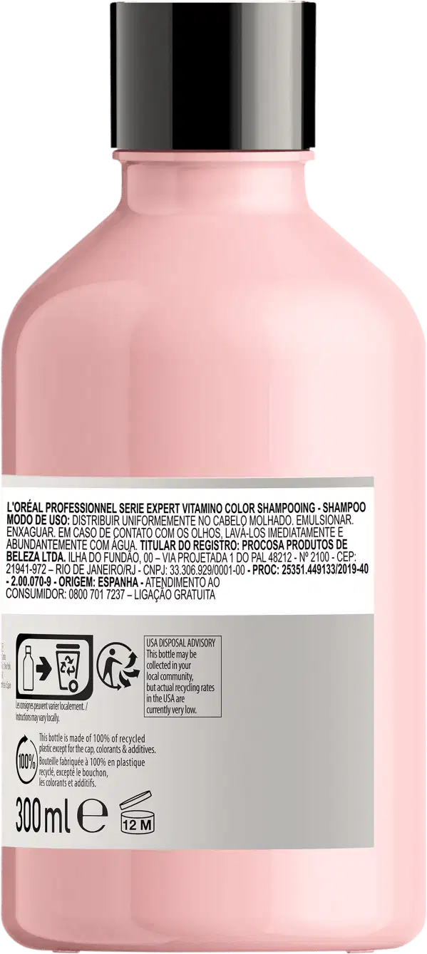 Frasco de item de perfumaria rosa com rótulo branco. Recipiente cilíndrico com tampa preta. Texto em português no rótulo indica tratar-se de um shampoo da marca L'Oreal.