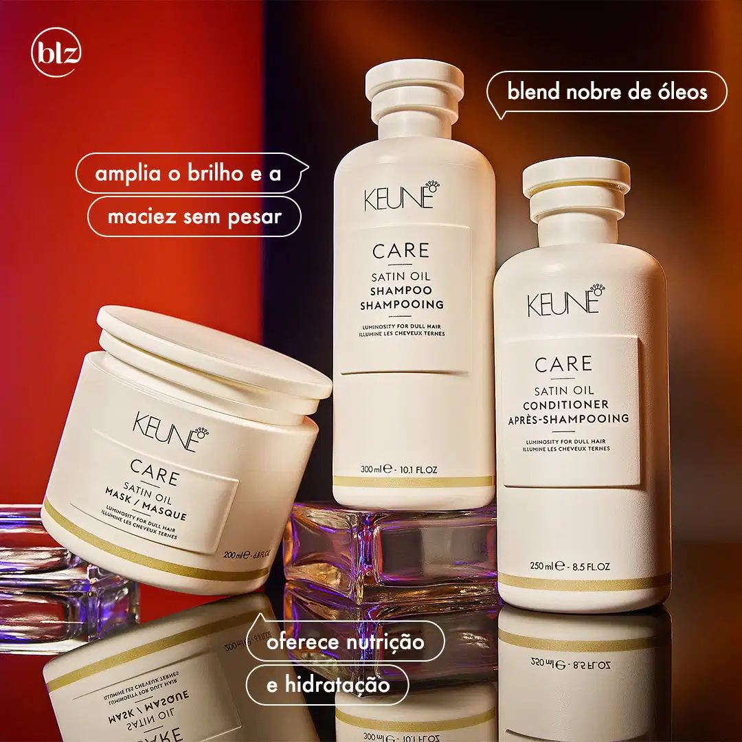 Ambiente de produtos de beleza da marca Keune, com embalagens de shampoo, condicionador e máscara de óleo de seda em tons de branco e dourado, destacados em um fundo vermelho e laranja, sugerindo uma apresentação de produtos para cuidados capilares.