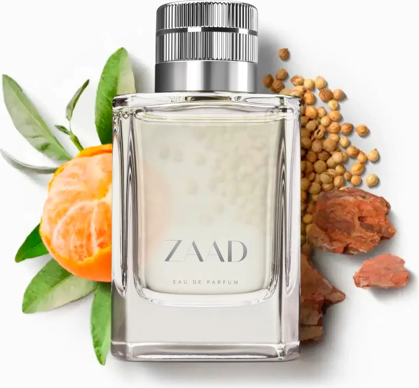 Vidro transparente com líquido cinza, tampa prateada e letras cinzas de Eau de Parfum Zaad sobre superfície branca, cercado por folhas verdes, tangerina, cevada e sementes marrom-avermelhadas.