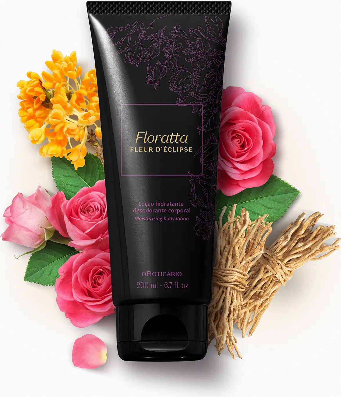 Bisnaga preta com letras e detalhes dourados contendo 200g de loção hidratante corporal Floratta Fleur d' Éclipse cercado por rosas rosa, flores amarelas, galhos secos e pétalas sobre fundo branco.