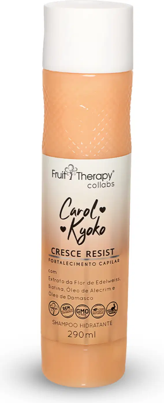 A imagem mostra uma embalagem de shampoo de cor clara com detalhes em tom de laranja. Contém 290ml do produto. Também indica que o produto é vegano, não testado em animais e livre de parabenos, segundo os selos presentes na embalagem.