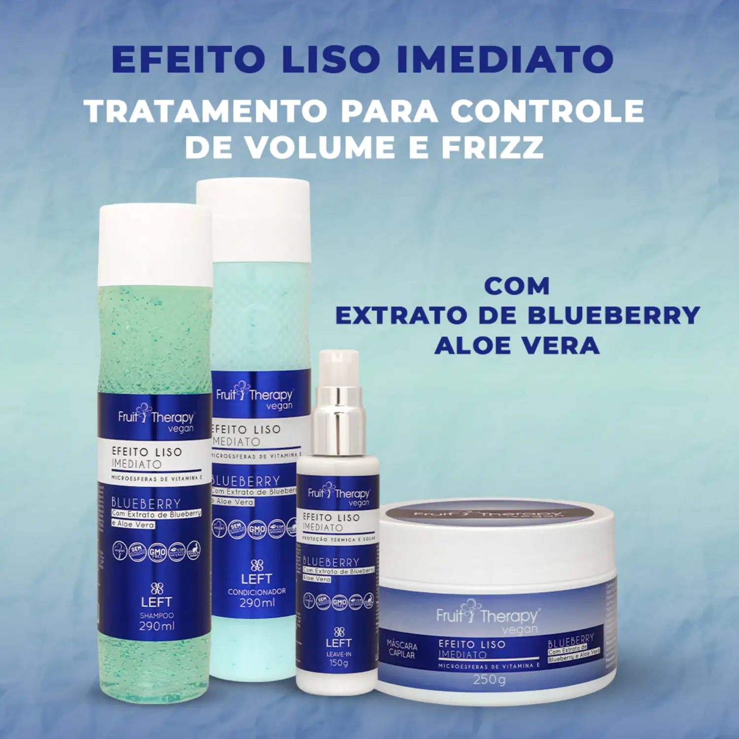 A imagem mostra a linha de produtos Fruit Therapy Vegan Blueberry Efeito Liso Imediato. A foto traz um shampoo, condicionador, leave-in e máscara de tratamento. Todos com um rótulo azul.