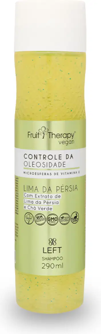 A imagem mostra um frasco transparente com rótulo amarelo e tampa branca de 290ml do shampoo da linha Fruit Therapy Vegan Lima da Pérsia, onde é possível ver o conteúdo amarelado por dentro. O design traz informações sobre benefícios e composição.