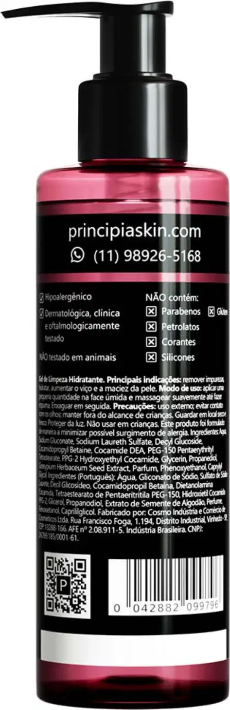 Frasco de produto de beleza da marca Principia, com embalagem rosa e preta, contendo informações sobre o produto e seus ingredientes. O frasco possui um rótulo com o site e contato da empresa.