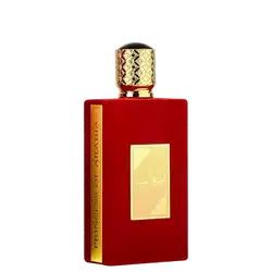 Frasco de perfume vermelho da marca Lattafa Perfumes, com tampa dourada e rótulo dourado com texto árabe. O frasco possui um design elegante e sofisticado.