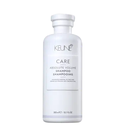 Frasco branco da linha Care da Keune, contendo Shampoo Absolute Volume. O produto é destinado a volumizar cabelos normais a finos, conforme indicado no rótulo.