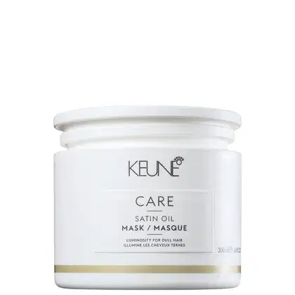 Frasco branco com rótulo da marca Keune, contendo máscara de óleo de seda para cabelos opacos, com informações sobre luminosidade e tratamento para cabelos.