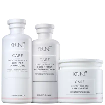 Três produtos de cuidados capilares da marca Keune Care, incluindo um shampoo, um condicionador e uma máscara, todos em embalagens brancas com detalhes em preto e cinza.