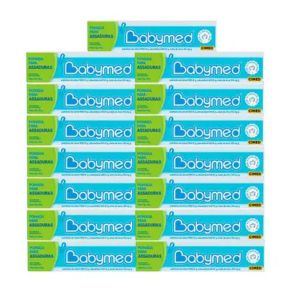 Caixas de pomada para assaduras da marca Babymed, em embalagens verdes e azuis, com informações sobre o produto e a marca Cimed impressas.