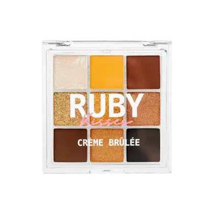 Paleta de sombras Sweets Collection, da marca Ruby Kisses. São noves cores com tons neutros, que se aproximam do amarelo, dourado e marrom.