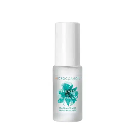 Frasco branco de Moroccanoil contendo um spray de fragrância com o nome "Brumes du Maroc" impresso no rótulo. O produto é descrito como uma névoa de fragrância.