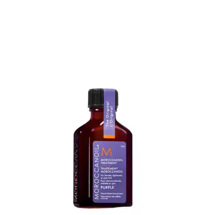 Frasco de tratamento Moroccanoil na cor roxa, com rótulo destacando o nome do produto "Moroccanoil Treatment Purple" e informações sobre seu uso para cabelos loiros, descoloridos ou grisalhos.