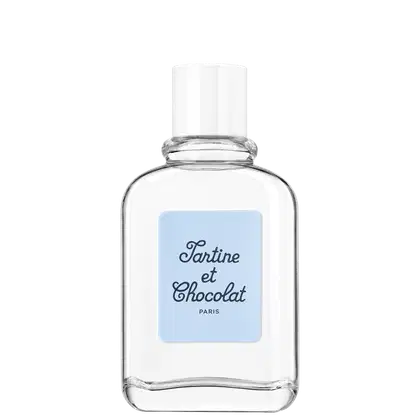 Frasco de vidro transparente com rótulo azul claro contendo o texto "Tartine et Chocolat Paris". O produto parece ser um item de beleza ou perfumaria da marca Tartine et Chocolat, com design elegante e minimalista.