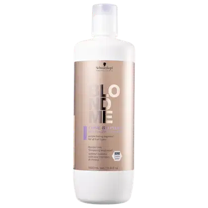 Frasco plástico branco opaco de 1000ml com rótulo marrom claro.  Apresenta o logotipo Schwarzkopf Professional e informações como volume e instruções de uso.