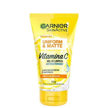 Gel de limpeza antibacteriano Garnier Skinactive Vitamina C, com embalagem amarela e branca, apresentando informações sobre uniformidade e matificação da pele.