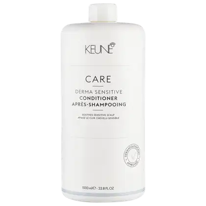 Frasco branco de condicionador Keune Care Derma Sensitive, com 1000 ml de capacidade. O rótulo apresenta o nome da marca, o tipo de produto e a indicação de que é aprovado dermatologicamente.
