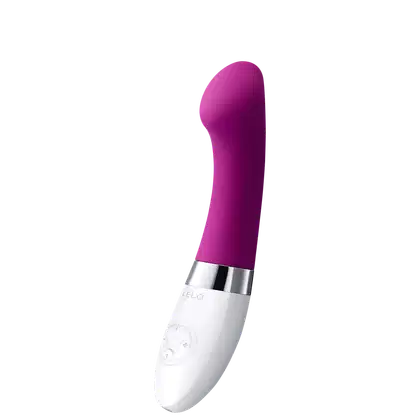 Este é um vibrador pessoal de silicone na cor roxa intensa. Possui um formato alongado e arredondado em uma extremidade. A base é branca e apresenta o logotipo "LELO" gravado. Há também alguns botões ou controles visíveis na base branca.