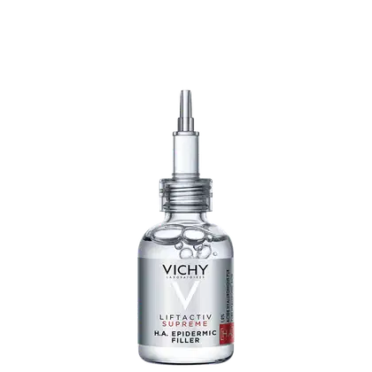 Frasco de vidro transparente com pipeta dosadora contendo o sérum Liftactiv Supreme da Vichy, com rótulo destacando o ingrediente H.A. Epidermic Filler. Embalagem em cores branca e prata, com o logotipo da marca Vichy.