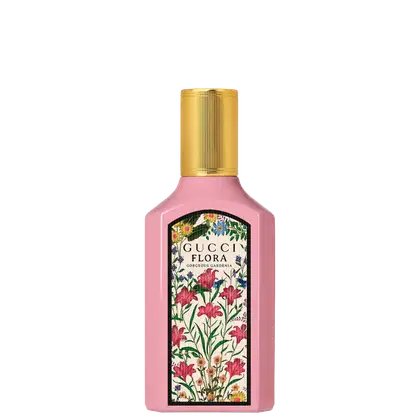 Frasco de perfume Gucci Flora com design floral colorido em fundo rosa, com rótulo dourado destacando o nome da fragrância "Gorgeous Gardenia".