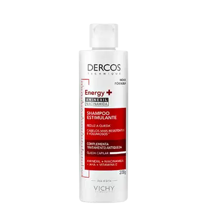 Frasco branco com rótulo vermelho e branco da marca Dercos Technique, contendo shampoo estimulante Energy+ com aminexil, niacinamida e vitamina E, para cabelos mais resistentes e volumosos.