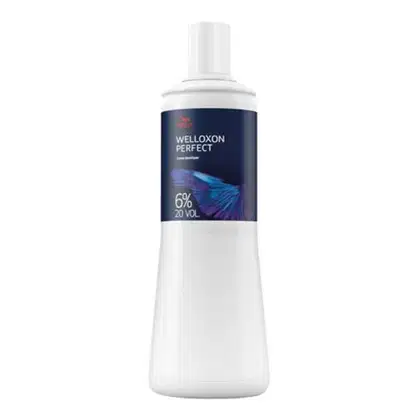 Frasco de creme descolorante Welloxon Perfect da Wella, com 6% de peróxido de hidrogênio e 20 volumes. O frasco é branco e azul marinho, com o nome do produto e informações sobre o conteúdo claramente exibidos.