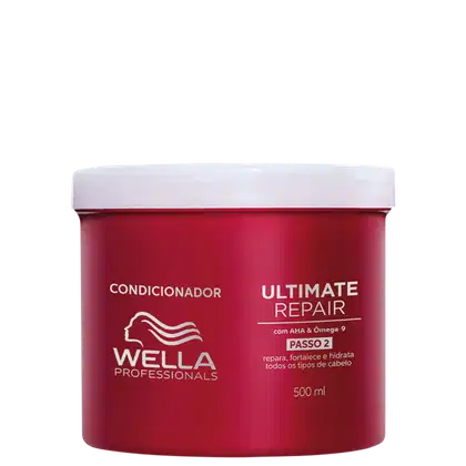 É um condicionador para cabelos da marca Wella Professionals. O produto vem em uma embalagem vermelha com tampa branca. A embalagem tem capacidade de 500ml. O rótulo indica que é o "Ultimate Repair Passo 2", um condicionador para reparar e hidratar.