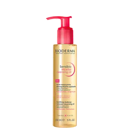 Frasco de óleo de limpeza micelar da marca Bioderma, com bomba doseadora vermelha, rótulo dourado e texto "Sensibio Micellar Cleansing Oil" em destaque.