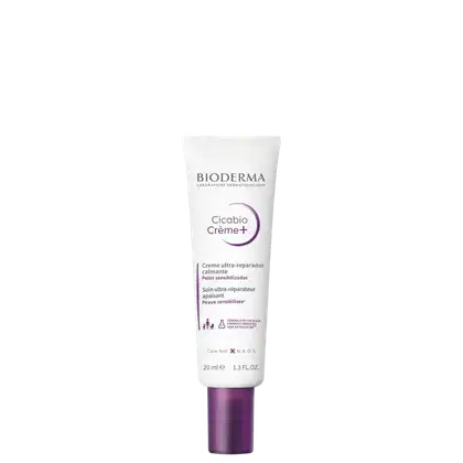 Tubo de creme Cicabio Creme+ da marca Bioderma, com embalagem branca e roxa, contendo 20 ml do produto. O rótulo indica que se trata de um creme ultra-reparador calmante para peles sensibilizadas.