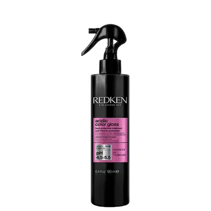 Frasco preto com rótulo rosa da marca Redken contendo tratamento para proteção da cor dos cabelos, com tecnologia avançada de pH.