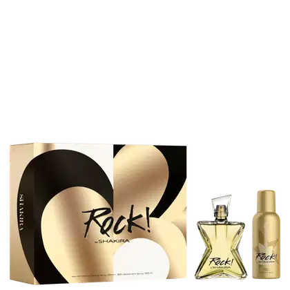 Conjunto de produtos de perfumaria da marca Shakira. Inclui um frasco de perfume em formato triangular com líquido dourado, uma caixa preta e dourada com o nome "Rock!" em letras cursivas, e um frasco menor de desodorante spray na mesma tonalidade dourada