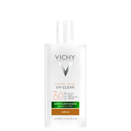 Embalagem em frasco plástico branco opaco. Rótulo frontal com o logotipo Vichy e o nome do produto "Capital Soleil UV-Clear" em letras cinza. Indicação de FPS 60 e descrição "Antioleosidade Aqua-Fluido Cor 4.0".