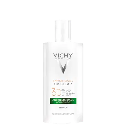 Embalagem em frasco plástico branco opaco. Rótulo frontal com o logotipo Vichy e o nome do produto "Capital Soleil UV-Clear" em letras cinza. Indicação de FPS 60 e descrição "Antioleosidade Aqua-Fluido Sem Cor".