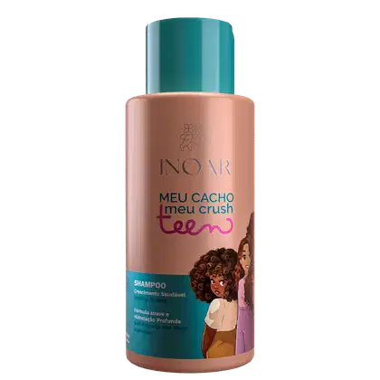 A imagem mostra o Shampoo Inoar Meu Cacho Meu Crush Teen 500ml em embalagem cilíndrica de plástico, com tons de rosa, roxo e verde. Traz ilustração de meninas com cabelos cacheados. O rótulo exibe a descrição Shampoo - Fórmula suave e Hidratação Profunda.