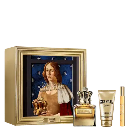 O produto apresentado é uma coleção de fragrâncias e itens de cuidados pessoais da marca Jean Paul Gaultier. Inclui um frasco de perfume dourado, uma loção corporal em embalagem dourada e um frasco de perfume menor.