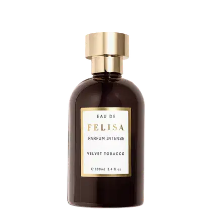 Perfume intenso Felisa Velvet Tobacco em frasco de vidro âmbar de 100ml. Embalagem cilíndrica com tampa dourada. Rótulo retangular dourado com texto "Eau de Felisa Parfum Intense Velvet Tobacco" em letras brancas.