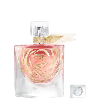 Perfume em frasco retangular transparente com líquido rosa e detalhes dourados em espiral. Cores predominantes são rosa, dourado, branco e transparente. Não há texto ou rótulos visíveis além dos elementos decorativos do frasco.