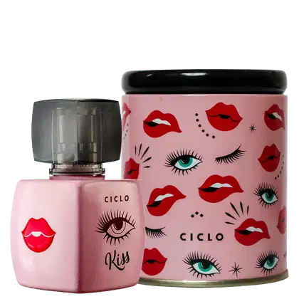Perfume em frasco de vidro rosa com tampa preta. Ao lado, uma lata cilíndrica rosa com padrão de olhos maquiados e lábios vermelhos espalhados. O nome "Ciclo" está impresso em ambas as embalagens.