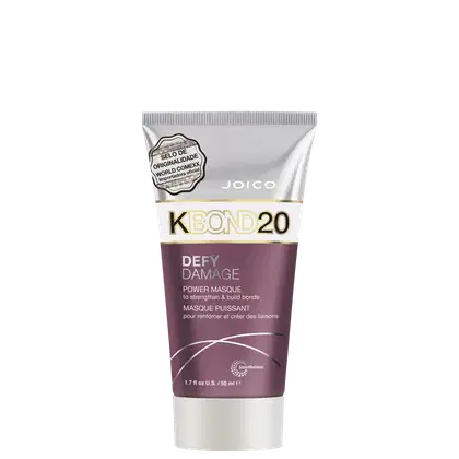 A embalagem é um tubo plástico roxo, branco e prateado com detalhes em dourado. O rótulo frontal apresenta o nome do produto e informações como "para fortalecer e criar ligações".