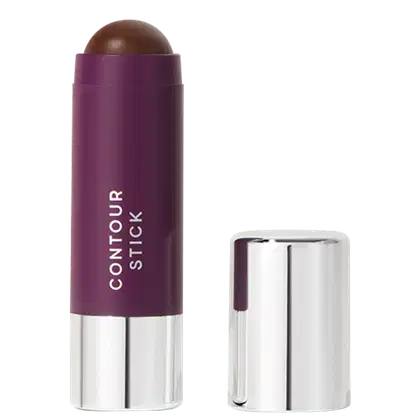 A imagem mostra o produto Contour Stick da marca Océane. Um bastão de maquiagem em formato cilíndrico com embalagem roxa e tampa prateada ao lado. O nome do produto "CONTOUR STICK" está impresso em letras brancas sobre a cor roxa.