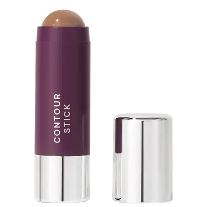 A imagem mostra o produto Contour Stick da marca Océane. Um bastão de maquiagem em formato cilíndrico com embalagem roxa e tampa prateada ao lado. O nome do produto "CONTOUR STICK" está impresso em letras brancas sobre a cor roxa.