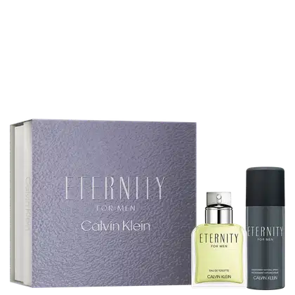 Caixa retangular cor cinza texturizada com "Eternity for Men" em relevo. Frasco de perfume em vidro transparente com líquido amarelo claro e tampa prateada. Desodorante spray preto cilíndrico com rótulo "Eternity for Men".