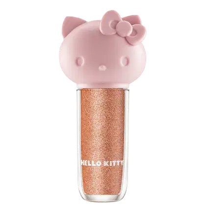 Maquiagem em formato cilíndrico com a cabeça da personagem Hello Kitty como tampa. A parte superior é rosa com detalhes em relevo que representam os olhos, orelhas e laço da Hello Kitty. É possível ver a cor do produto pelo corpo transparente.