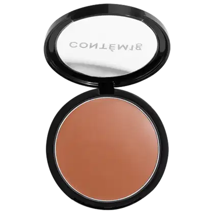 A imagem mostra uma embalagem aberta de bronzer cremoso. A embalagem é preta com parte transparente e o logo da marca em branco.